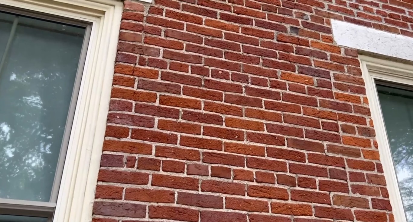 Professional brick repair and restoration work on a residential red brick wall in Temecula, CA